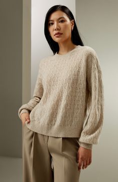 This sweater has a twisted pattern all over and the special yarn gives it a plush feel. Match it with an elegant long skirt for a delicate overall look, or select wide-legged trousers for a more casual look. It's perfect as an outerwear piece for early autumn. 75% cashmere+25% silk round neck oversize wearable from fall to winter Elegant Cable Knit Sweater For Spring, Spring Cashmere Sweater With Pointelle Knit, Elegant Cream Sweater For Fall, Chic Cashmere Textured Knit Sweater, Spring Cashmere Textured Knit Sweater, Chic Cashmere Sweater With Pointelle Knit, Elegant Beige Sweater With Soft Texture, Chic Cashmere Sweater With Textured Knit, Spring Cashmere Sweater With Textured Knit