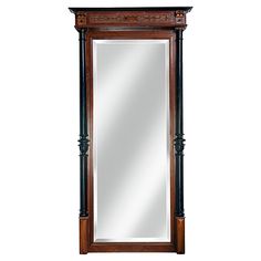 a large mirror sitting on top of a wooden shelf