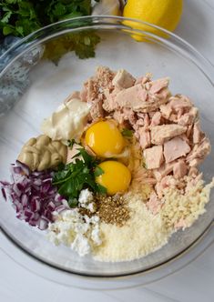 the ingredients for this dish include meat, eggs and cheeses in a glass bowl