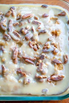 a casserole dish with nuts and cream in it