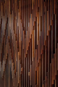 a wooden wall with many pieces of wood on it