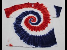 a red, white and blue tie - dyed t - shirt with a spiral design