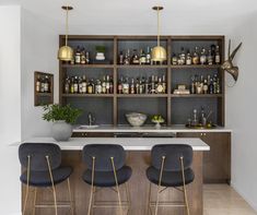 home bar custom bar interior design oak shelving whiskey interior design bar seating counter stools brass pendants Modern Farmhouse Bar Area, Wallpaper For A Bar Area, Long Wall Bar Ideas For Home, Wallpaper Behind Bar Shelves, Home Bar Seating Ideas, Wallpaper Behind Bar, Bar Room Ideas In House Modern, Home Bar With Seating, Modern House Bar Design