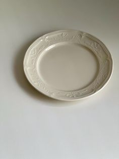 a white plate sitting on top of a table