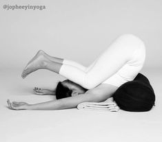 a woman is laying on the floor with her legs crossed