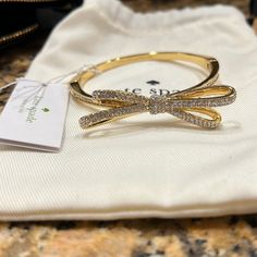 Kate Spade Bangle Bracelet With Crystals And Bow Detail. Nwt Jewelry Gold Aesthetic, Kate Spade Bow Bracelet, Golden Accessories, Dope Jewelry Accessories, Kate Spade Bracelet, Kate Spade Bangle, Wrist Jewelry, Dior Jewelry, Gold Pendant Jewelry