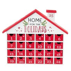 a red and white house shaped calendar with the numbers twenty five in front of it