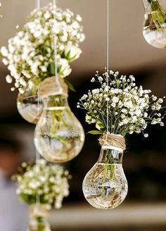 hanging glass vases filled with baby's breath flowers