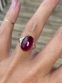 Genuine Pink Tourmaline measures 14mm x 10mm. The head of the ring measures 14mm at its widest point. The ring weighs 5.5g. The band tapers to 2.25mm at the back of the shank.  It is stamped 14k yellow gold. This ring is a size 5.25 and sizable. We are happy to provide sizing for an additional charge.  Let me know if you need a quote. Pear Cabochon Ring, Ruby Ring Cabochon, Fine Jewelry Ruby Oval Cabochon Ring, Fine Jewelry Ruby Cabochon Ring, Classic Tourmaline Jewelry With Polished Finish, Formal Cabochon Domed Ruby Ring, Elegant Domed Ruby Ring, Fine Jewelry Ruby Ring With Oval Cabochon, 14k Gold Oval Cabochon Gemstone Signet Ring