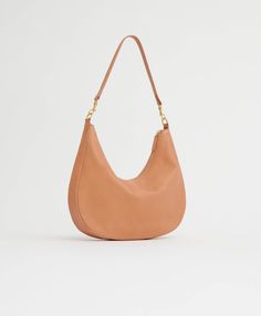 !!!Description---Our soft, slouchy hobo bag is spacious enough to carry your essentials, yet compact enough to carry comfortably every day. Made with the softest Italian vegetable tanned leather, the Swing Bag features two detachable straps to wear as a shoulder or crossbody style. !!!Fits---iPad !!!Details---Width: 14.4 in / 36.5 cm Height: 8.26 in / 21 cmDepth: 2.4 in / 6 cmStrap Drop: 11.8 in / 36 cm Crossbody Drop: Min: 24.8 in / 63 cm, Max: 26 in / 66 cm Composition: 100% Italian Vegetable Slouchy Hobo Bag, The Swing, Vegetable Tanned Leather, Bago, Hobo Bag, Italian Leather, Every Day, Shoulder Bag, Leather