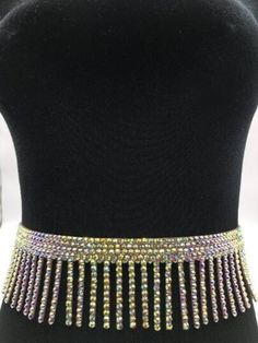 Sparkly rhinestone belt. Made with glass crystals. Don't stretch.  Snap closure.  Width: 2 3/4 inches (7 cm) Fitted Rhinestone Belts For Party, Silver Rhinestone Belt For Party, Silver Bling Belts For Party, Silver Party Belt With Bling, Adjustable Rhinestone Party Belts, Silver Fitted Belts For Party, Silver Fitted Belt For Party, Fitted Crystal Bridal Belt For Party, Glamorous Party Bridal Belt With Rhinestones