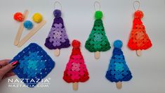 crochet christmas tree ornaments made with yarn and pom - poms are displayed