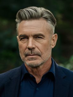 For older men who appreciate a more subdued style, a matured elegance version of the textured slick back brings sophistication. This style is perfect for men with graying hair, enhancing the natural texture and color. Long Face Shapes, Men With Grey Hair, Side Swept Bangs, Slick Back, Men Hairstyles, Slicked Back Hair, Long Faces, Edgy Style