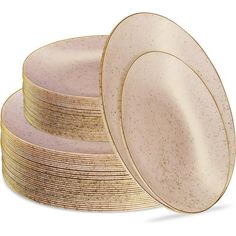 a stack of beige plates sitting on top of each other next to another plate with gold rims