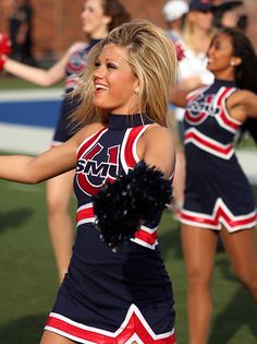 a group of cheerleaders perform on the field