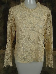 "Exquisite turn-of-the-century, entirely handmade, bobbin lace blouse, of pale ecru silk thread in an amazingly intricate design. This is a rare find and a wonderful example of just how beautiful handmade lace can be. I've had this in my personal collection for over 20 years, and parting with it will be difficult because it's unlikely that there is another like it. However, I do enjoy sharing fine things with my customers. It's a small size, about a 4, and measures approx. 14\" across the should Crochet Lace Jacket, Womens Blouses, Gorgeous Blouses, Lace Jacket, Handmade Lace, Peasant Dress, Bobbin Lace, Silk Thread, Lace Blouse