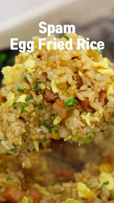 an egg fried rice dish is being held up with a wooden spoon over it and the words spam egg fried rice