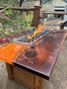 a wooden table with flames burning on it