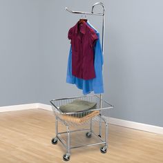 a laundry basket with clothes hanging on it