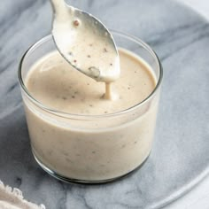 a spoon is in a small glass bowl