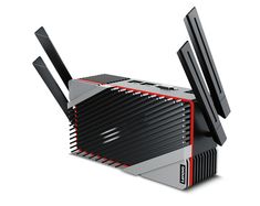 the router has two antennas attached to it's back end and is black with red accents