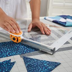 Fiskars Rotary Cutter and Ruler Combo (12" x 12") 195140-1002 is great for beginners, the unique design of this tool makes cutting perfect shapes from fabric a breeze -- since you're not managing two tools separately, you don't have to struggle with a misaligned ruler or worry about holding the rotary cutter straight. It includes a 45 mm spring-action rotary blade that makes clean cuts through multiple layers of fabric and an ergonomic blade carriage that makes cutting smooth and easy. The ruler Homemade Quilts, Seam Rippers, Sewing Room Organization, Embroidery Blanks, Grid Print, Lap Quilts, Embroidery Supplies, Bear Doll, Erasers