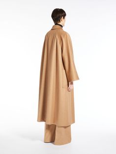 Ready to elevate your style in the most luxurious way possible? This classic camel coat, made from 100% real Mongolian camelus dromedarius, is your answer. Its timeless design and superior quality truly make it a wardrobe staple you never knew you needed. Size: 36 is perfect for a form-fitting yet comfortable fit. Color: The neutral camel tone (001) blends well with any outfit, making it a versatile piece for all seasons. Composition: Made from 100% camelus camelus dromedarius from Mongolia, off Max Mara Jacket, Versatile Jacket, Camel Coat, Outfit Making, Elegant Designs, Camel Color, Dress Pant, Sweaters Knitwear, Emilio Pucci