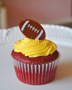 a cupcake with a football on top