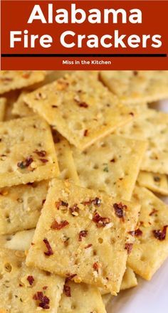 a white plate topped with crackers covered in cheese