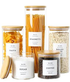 several jars filled with different types of pasta and other food items on a white background