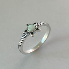 Sterling Silver White Lab Opal Star Ring, Silver Ring, Opal Ring, Star Ring, Sky Ring, Boho Ring, Statement Ring, Promise Ring, Friendship Ring, Anniversary, 925 Stamped *  Perfect gift idea for any occasion: birthday, anniversary, engagement, graduation, bridesmaid, Mother's Day, Valentine's Day, Christmas, promise. *  Your purchase includes a gift box. Let us know if this is a gift and we can ship directly to the recipient and include a personalized note. *  We greatly appreciate your order with us.  *  Note: Due to the difference between different phone or monitors the pictures look bigger than what the rings or pendants are and may not reflect the actual color of the Necklace or Ring. Face Height: 7.8 mm Stone: White Lab Opal Metal Material: Sterling Silver Star Promise Rings, Spiritual Star-shaped Ring As A Gift, Silver Star Ring, Opal Ring Silver, Opal Promise Ring, Star Rings, Friendship Ring, Friendship Rings, Ring Opal