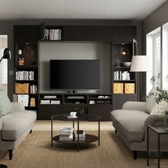 a living room filled with furniture and a flat screen tv