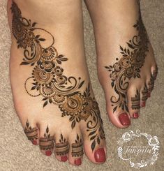 the feet are decorated with henna designs