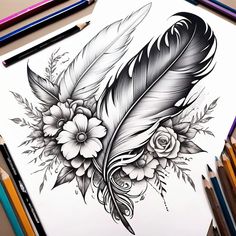 a black and white drawing of a feather with flowers on it next to colored pencils