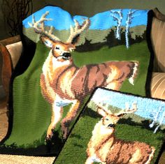 two crocheted deer afghans sitting on top of a couch