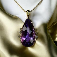 SAME DAY SHIPPING! This is a gorgeous solid 10k Yellow Gold necklace with a mesmerizing LARGE 7 Carat Pear Cut Faceted Natural Amethyst gemstone and diamond accents in a prong setting. The solid 10k yellow gold chain is approximately 20 inches long, pendant approximately 28.5mmx15mm. Excellent anniversary gift for wife, girlfriend, february birthstone birthday gift for daughter, etc.!  Mothers Day Gift or Christmas Gift! We also sell 10k, 18k, and 14k jewelry, engagement rings, wedding rings, promise rings, Christmas gifts, April birthstone rings, birthday gifts, Valentine's Day gifts, fall fashion jewelry, diamond rings, sapphire jewelry, ruby & emerald pendants, necklaces, bracelet, earrings, chain, luxury jewelry, &waterfall rings.Color may vary due to monitor settings. Everything we se Emerald Pendants, Gift For Wife Birthday, April Birthstone Ring, Rings Sapphire, Birthday Gift For Daughter, Jewelry Ruby, Rings Promise, Birthstone Rings, Earrings Chain