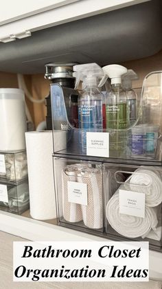 the bathroom closet organization ideas are organized with clear bins and plastic containers for storage