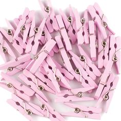 pink wooden clothes pegs with metal snaps