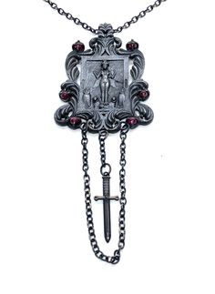 This Shrine necklace is cast in bronze, hand textured, oxidized and set with garnets. This piece is made to order and can take from 2-3 weeks to complete. Gothic Pendant Necklace With Antique Finish, Gothic Metal Necklace With Antique Finish, Gothic Collectible Pendant Jewelry, Collectible Gothic Pendant Jewelry, Gothic Oxidized Pendant Jewelry, Gothic Oxidized Pendant Necklaces, Gothic Oxidized Pendant Necklace, Gothic Bronze Jewelry With Antique Finish, Hand Forged Silver Necklaces For Ceremonial Occasions