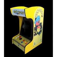 an old school arcade machine with the pac man logo on it's front cover