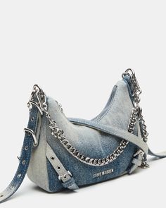 The VITAL denim bag features a slim hobo-inspired silhouette with buckle, chain, and grommet hardware giving the design a little edge. Distressed denim mini hobo bag Top zipper closure Interior zipper pocket Adjustable top handle with buckle hardware Top handle strap drop: 8 inches Crossbody strap drop: 24 inches 6.5in H x 9in W x 2.25in D Synthetic materials Duster bag included Imported Purse Inspiration, Mini Hobo Bag, Jeans Crafts, Jean Bag, Jean Purse, Dream Bags, Blue Jeans Crafts, Denim And Diamonds, Steve Madden Store