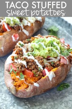 two loaded sweet potatoes on a plate with guacamole