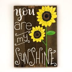 a wooden sign that says you are my sunshine with two sunflowers on it