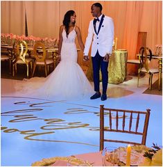 a bride and groom are standing on the dance floor