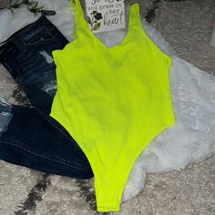 Neon Yellow Tank Bodysuit With Center Crotch Snaps Brand New, Never Worn Beautiful, Bold, Bright Color Ripping Through Out For Texture Pair With Jeans And Sneakers For A Nice Pair Of Heels!!! Treat Yourself For The New Year Green Stretch Bodysuit For Vacation, Green Sleeveless Bodysuit For Beach Season, Green V-neck Bodysuit For Summer, Sleeveless Green Bodysuit For Beach Season, Summer Beach Cotton Bodysuit, Summer One-piece Cotton Swimwear, Green Sleeveless Summer Bodysuit, Green V-neck Summer Bodysuit, Trendy Neon Swimwear For Summer