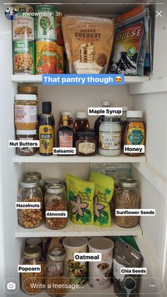 an open refrigerator filled with lots of food and labeled labels on the shelves above it