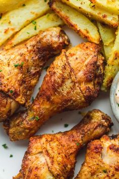 grilled chicken and french fries on a plate with ranch dressing in a small bowl