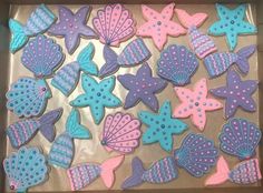 decorated cookies in the shape of fish and seashells