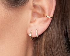 Gold Huggie Hoop Earrings, Tiny Huggie earrings, Small hoops with cz stone, Minimalist hoop earrings, Silver helix huggie, Second hole hoops Our DAINTY HUGGIE with sparkly CZ center stone .. Classic and minimal, wear it to add a sparkle to you awesome everyday look ☆.。.:* SOLD IN SINGLES OR PAIRS. *You can purchase our PAVE HUGGIES here:* https://www.etsy.com/listing/1073891116 DETAILS * Diameter (inner) : 9mm. * Material : Plated Brass / Sterling Silver. * Finishing : 18k Gold Plating. * Stone Minimalist Single Diamond Earrings For Everyday, Minimalist Hoop Earrings With Single Diamond For Everyday, Elegant Hoop Ear Wire Piercings, Minimalist Everyday Hoop Earrings With Single Diamond, Minimalist Cubic Zirconia Piercings For Everyday, Everyday Fine Jewelry Piercings, Minimalist Cubic Zirconia Huggie Cartilage Earrings, Minimalist Single Diamond Huggie Earrings, Dainty Hoop Earrings With Single Diamond