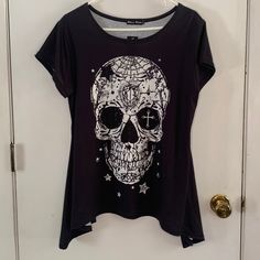 Nwt Black T-Shirt Style Knit Top With Shark Bite Hem White Skull Embellished With Black And Clear Bling Measurements Are Not Guaranteed. Length Is Measured From Center Of Back Neck Chest 20 1/2" Length 24" Keyword: Moto, Motorcycle, Harley Davidson, Goth, Gothic, Dark, Steampunk, Sturgis, Halloween Edgy Skull Print Crew Neck Top, Emo Skull Print Top For Fall, Black Stretch Tops With Skull Print, Emo Skull Print Tops For Fall, Fall Emo Skull Print Top, Black Stretch Top With Skull Print, Emo Skull Print Short Sleeve Tops, Emo Short Sleeve Top With Skull Print, Black Emo Top With Skull Print